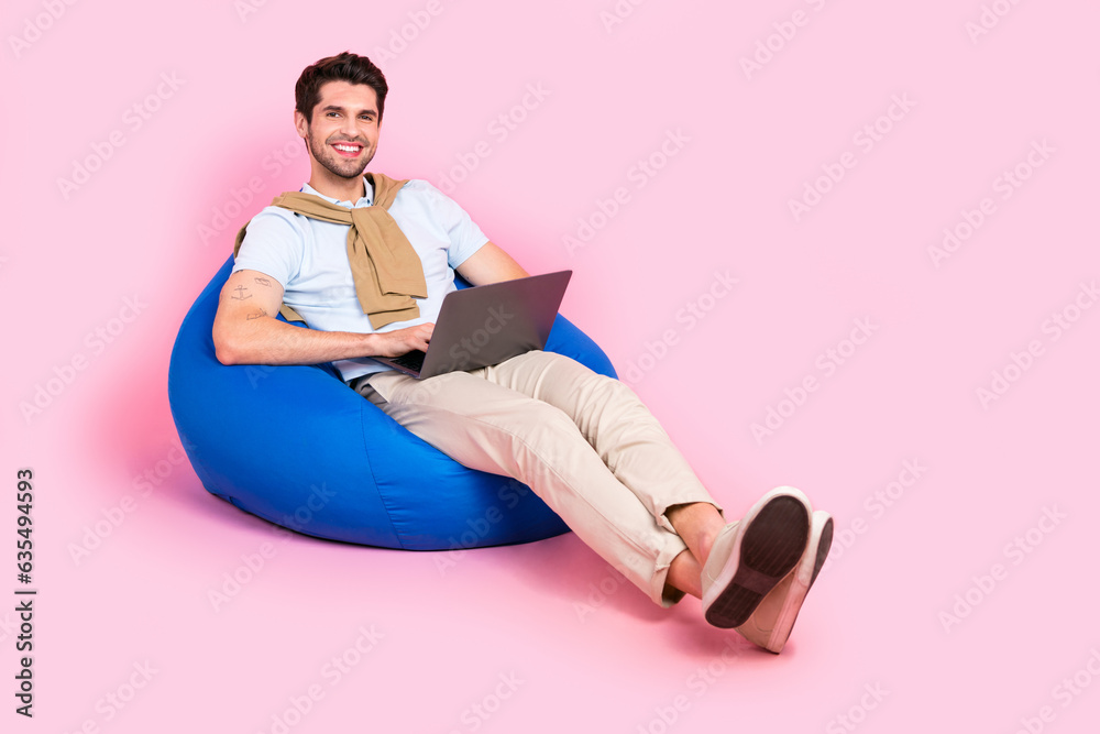 Aufkleber full length photo of young businessman remote coworking zone lying beanbag with netbook high product