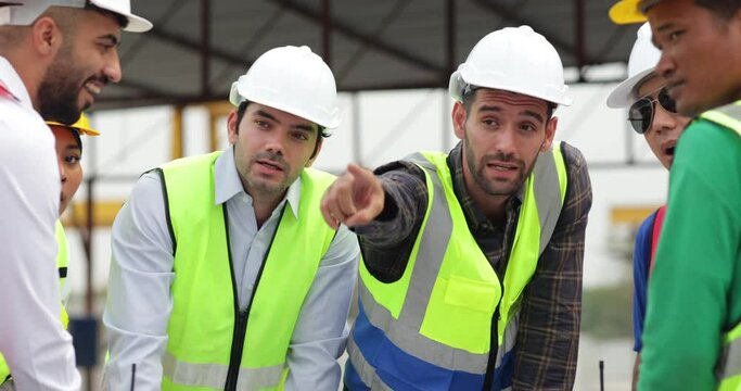 Success teamwork. Ethnic diversity worker people. Group of professional Construction engineering people wearing hardhat safety helmet meeting at Prefabricated concrete walls Industry Factory