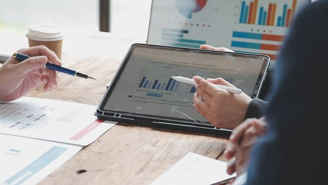 Teamwork with business people analysis cost graph on desk at meeting room. double exposure successful teamwork,business planning concept.