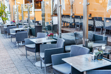 Summer restaurant on the city street. Outdoor cafe.