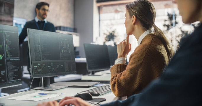 Beautiful Young Female Student Studying in Modern University with Diverse Multiethnic Classmates. College Scholars Work in College Room, Learning IT, Programming or Computer Science