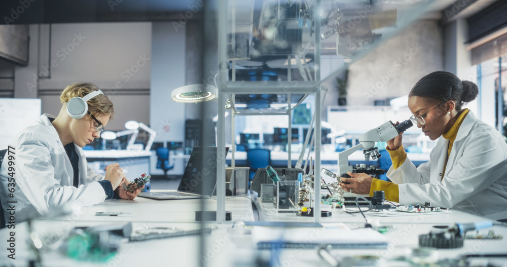 Poster Modern Science Research Laboratory in University: Diverse Young Scientists in White Coats Using Microscopes, Testing Circuit Boards and Microchips for a Technology Project in School