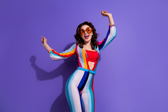 Photo of positive carefree girl wear stylish clothes have fun dancing rejoicing seasonal discount isolated on purple color background