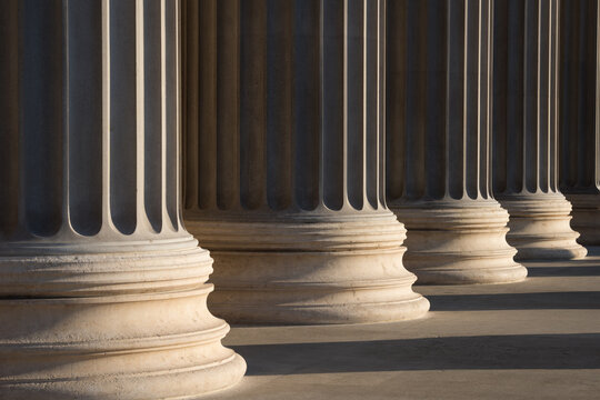 Colonnade of Ionic order columns, close up.