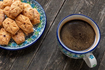 Italian sweet snack biscuit cookies with a cup of coffee.