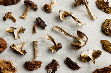 Dried edible forest mushrooms on a table. European cuisine ingredient.