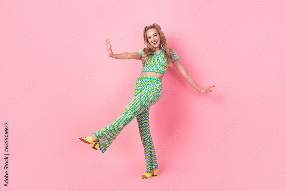 Poster Full size photo of attractive young woman dancing party clubber dressed stylish green print clothes isolated on pink color background