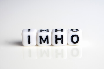 imho word or concept made by white letter cubes on white and gray background, in my honest humble opinion abbreviation - obrazy, fototapety, plakaty