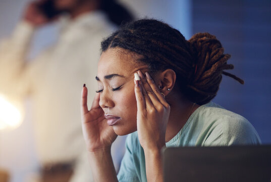 Business Woman, Headache And Stress In An Office At Night While Working Late On Deadline. Tired African Entrepreneur Person With Hands On Head For Pain, Burnout Or Depression While Thinking Of Work