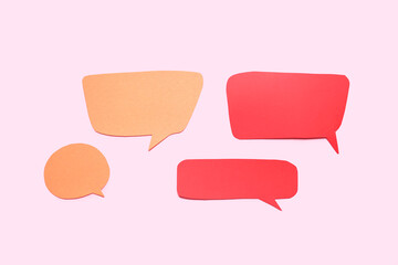 Blank speech bubbles on pink background