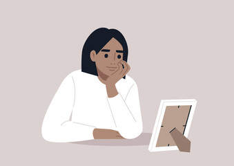 A young character propping up their face with hand, reflecting on a photograph in a white frame, daydreaming about their romantic crush