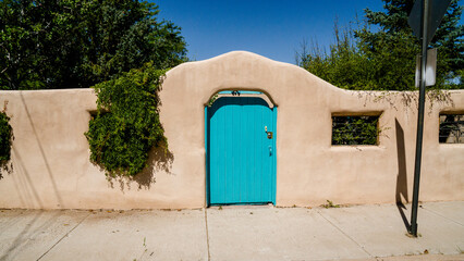 Adobe house with blue door 