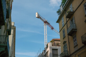 Fototapeta na wymiar cranes in the city center, housing incentives increase the development of new construction sites, construction sites, crane tower, eco-incentives, superbonus