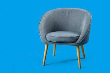 Obraz na płótnie Canvas Grey armchair on blue background