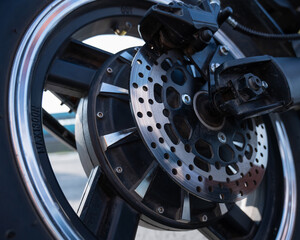 Close-up of a wheel with a motor of an electric motorcycle. 