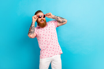 Photo of attractive cool man wear trendy print clothes look up empty space summer vacation travel...