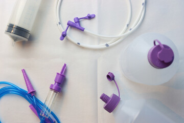 Syringe, bottle, infusion set and feeding tube for enteral nutrition infusion in a white...