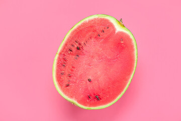 Half of ripe watermelon on pink background