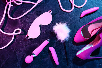 Different sex toys on dark color background - obrazy, fototapety, plakaty