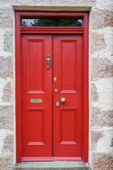 Red door on a Scottish cottage, Moray, Scotland. 
