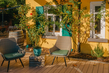 Image of a empty coffee tables arranged in backyard of a house. Autumn in Germany, Europe. Outdoor...