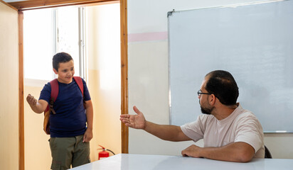 teacher explaining to his student separately and discussing some study fields to make sure they...