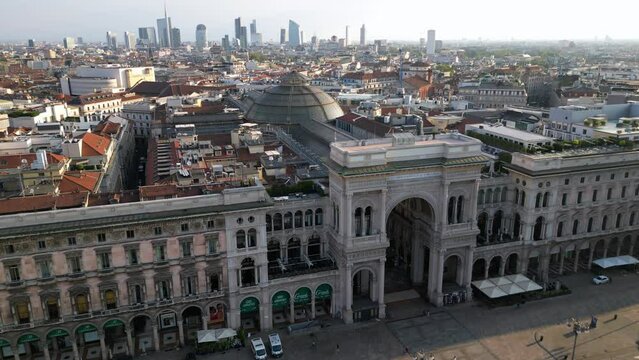 Europe, Italy , Milan - Drone aerial view of Piazza Duomo in city downtown - contrast between Vittorio Emanuele Gallery and the new modern skyline with skyscrapers in Garibaldi 