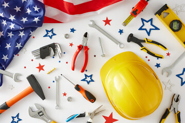 Celebrate Labor Day with honor. Top view arrangement of american flag, safety hard hat, worker...