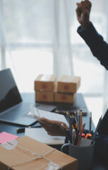 Starting small businesses SME owners female entrepreneurs Write the address on receipt box and check online orders to prepare to pack the boxes, sell to customers, sme business ideas online.