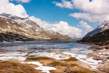 Fototapeta na wymiar Lake in Switzerland in spring with some ice, swiss alps landscape