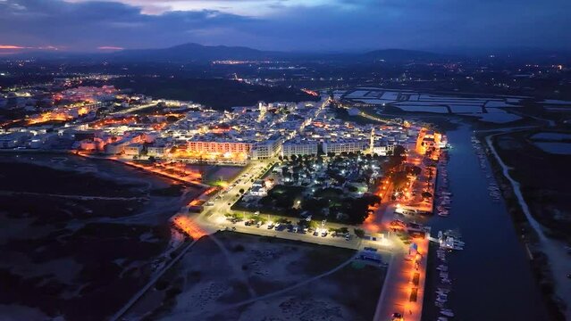 Sunset in Fuseta from an aerial drone view. Olh&atilde;o Municipality. Lighthouse district. Marshes and salt flats of the Ria Formosa Natural Park. Atlantic Ocean. Algarve. Portugal. Europe