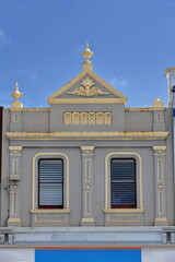 Gray-yellow painted sandstone facade of heritage building from AD 1898, Liebig Street....