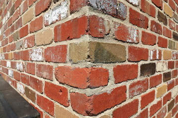 Brickwork quoining on a corner wall made of red-buff-tan colored bricks, Liebig Lane area....
