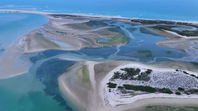 Sunset in Fuseta from an aerial drone view. Olh&atilde;o Municipality. Lighthouse district. Marshes and salt flats of the Ria Formosa Natural Park. Atlantic Ocean. Algarve. Portugal. Europe