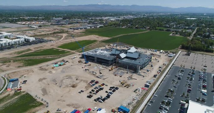 Commercial construction site with office and apartment buildings and future development land