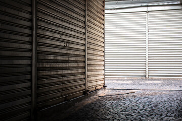 Metal roller shutter doors, in closed stores in popular shopping center in Brazil