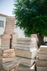 Melides, Alentejo, Portugal. June 18 of 2023. Sculpted marble books stacked artfully, a unique masterpiece gracing Melides village center. A blend of literature and craftsmanship