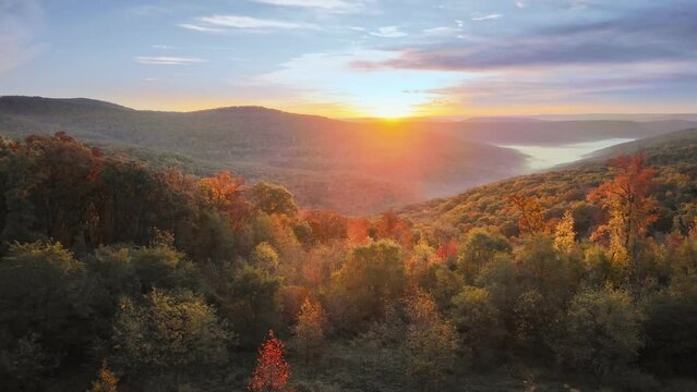 Beautiful Arkansas ozark mountain scenic overlook in fall with autumn colored forest via aerial viewpoint at sunrise