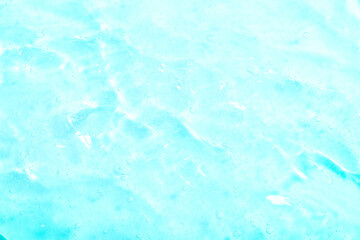 Cosmetic gel, serum transparent sample. Liquid cream with bubble texture. Gel texture of a cosmetic product. Clear liquid lotion for skin care.