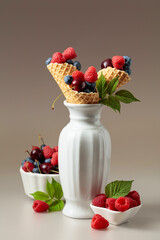 Fresh berries in waffle cones.