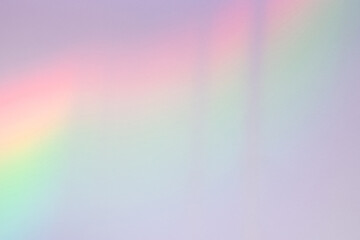 Neon rainbow gradient color light effect on white wall. Holographic light refraction overlay, subtle lighting, shading, unicorncore, lo-fi aesthetics. Abstract pastel colorful light leak bokeh texture