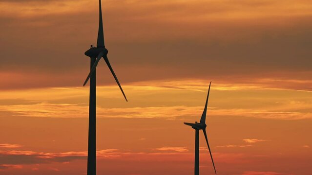 wind turbines at sunset