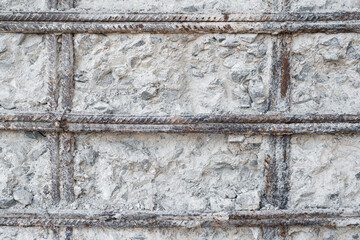 Reinforcing mesh in cement foundation concrete. Renovation