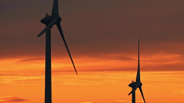 wind turbines at sunset