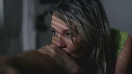 Fototapeta premium Introspective senior woman with lost in thought expression. Blank depressed emotion of female caucasian person struggling with loneliness