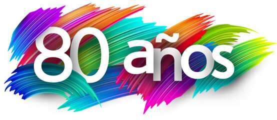 80 years at spanish paper word sign with colorful spectrum paint brush strokes over white. Vector illustration.