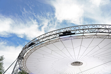 Round canopy roof of stretched fabric with lighting and Metal base structures