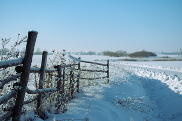 fence in winter with nice blue sky