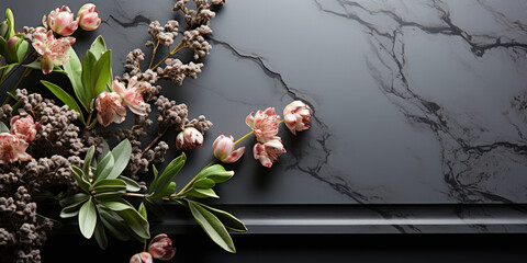 Blank black granite board outdoors. Mockup of a memorial or nominal plate with flowers. Template with copy space