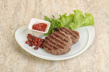 Grilled beef burger cutlet with sauce